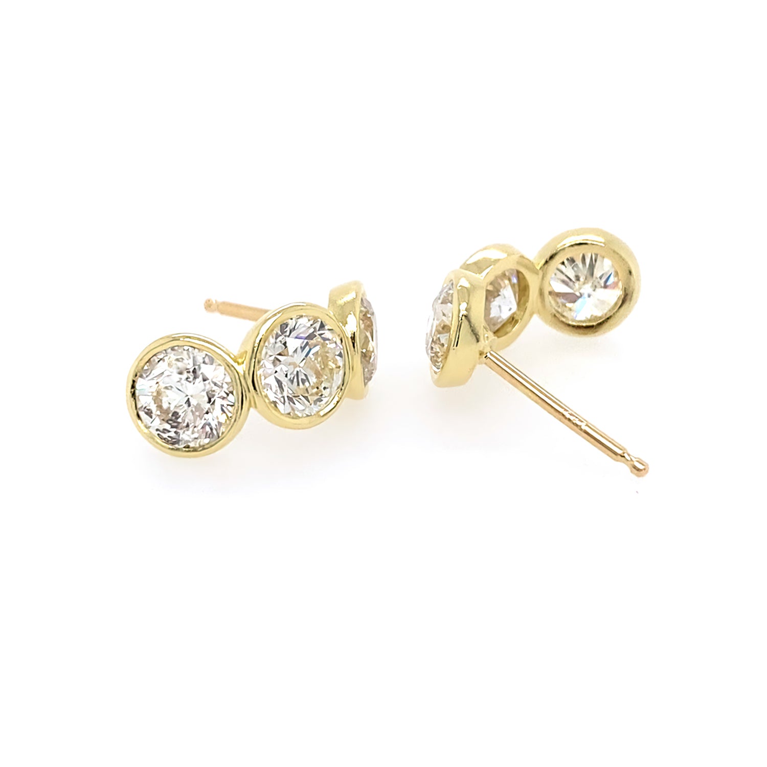 Custom designed 18K Gold earrings with bezel set diamonds