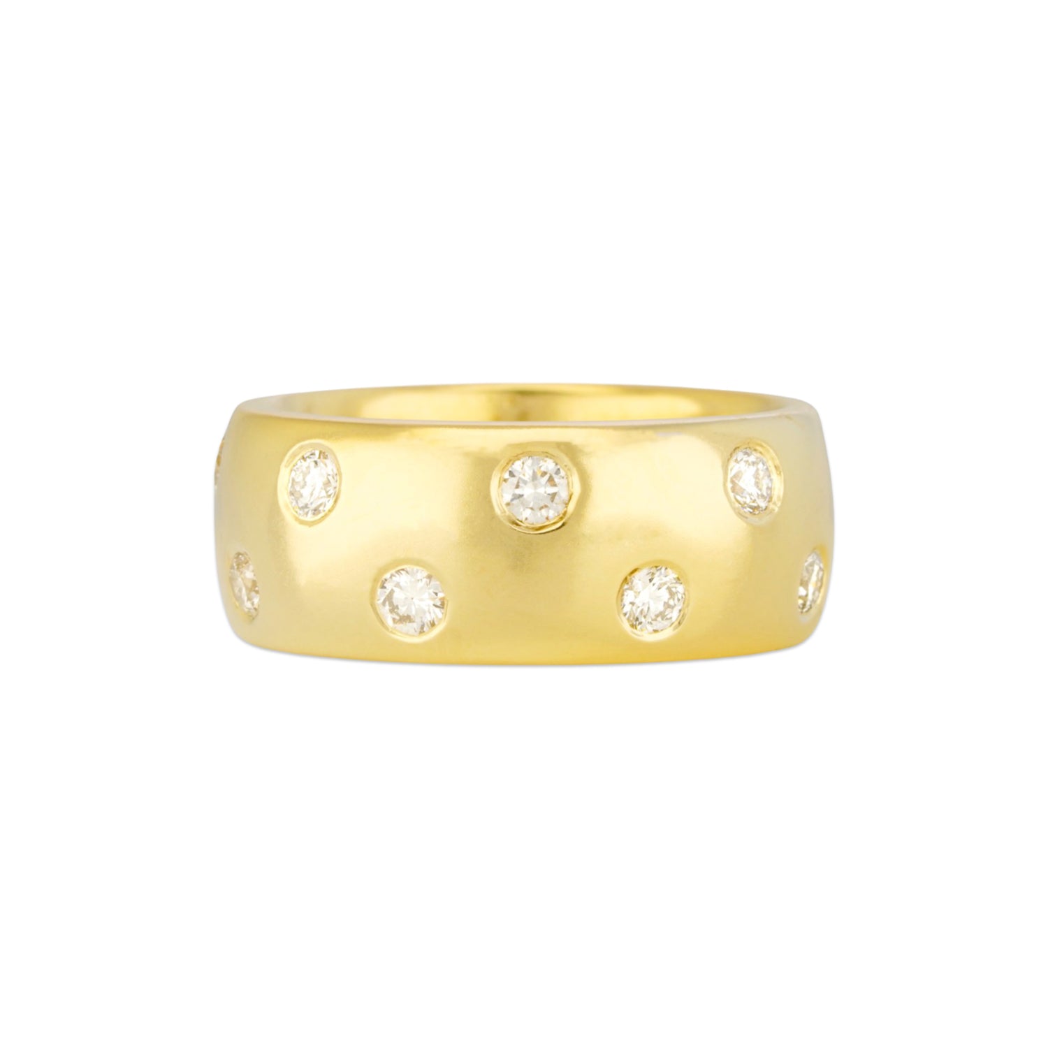 A 18K yellow gold wide band ring with flush set diamonds creating a polka dot pattern.