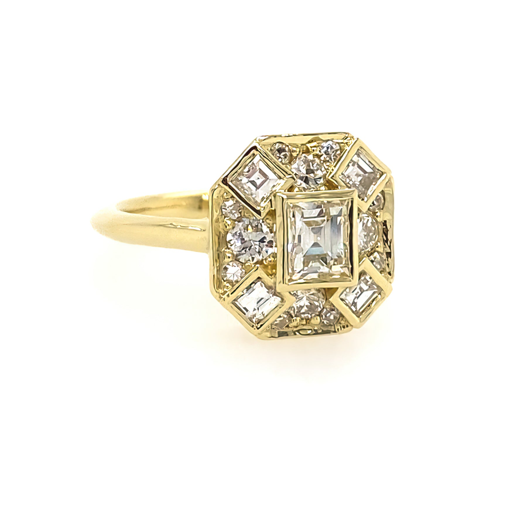 An 18kt yellow gold ring with a central square-shaped diamond surrounded by smaller square and round diamonds 