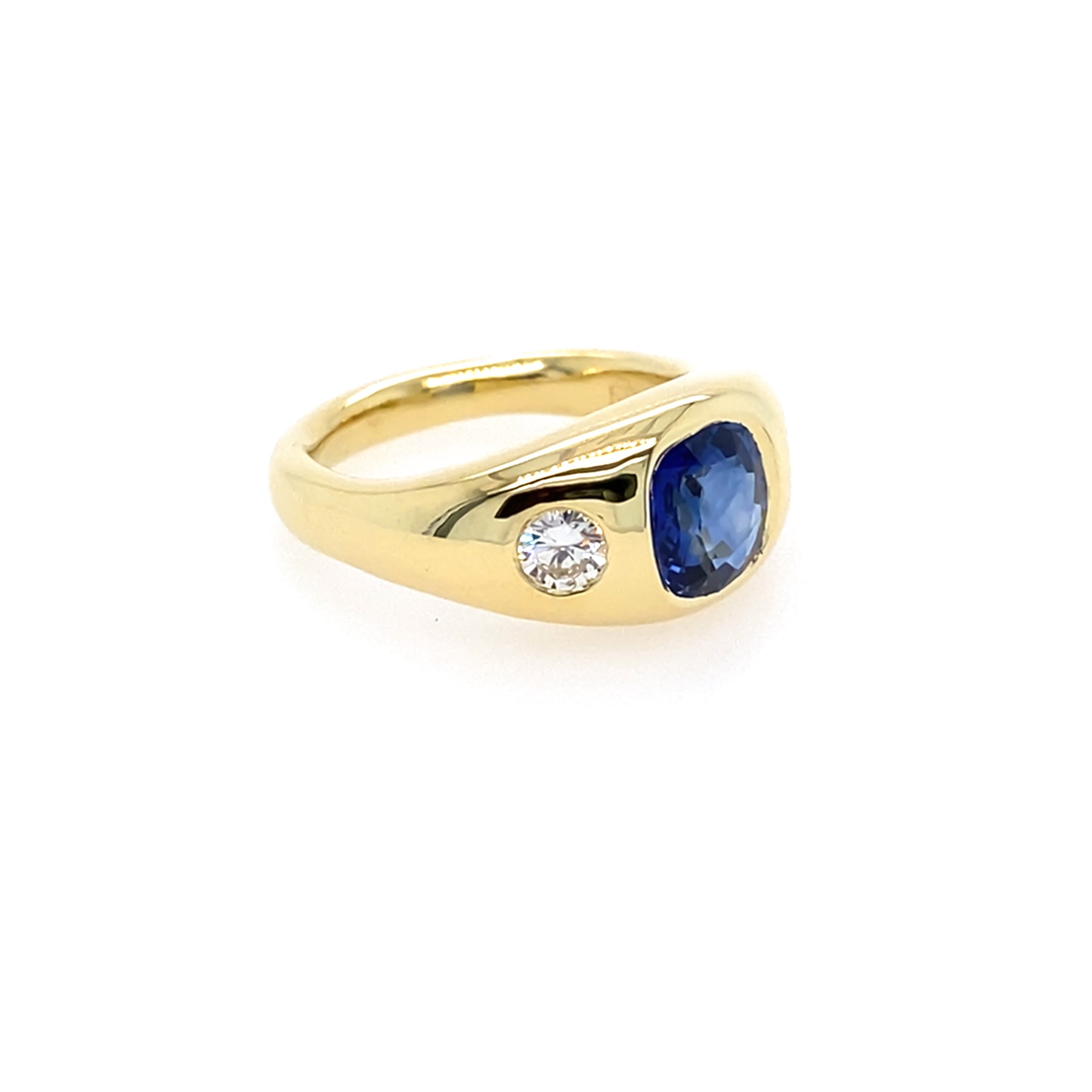 yellow Gold ring with a blue sapphire and diamond side stones