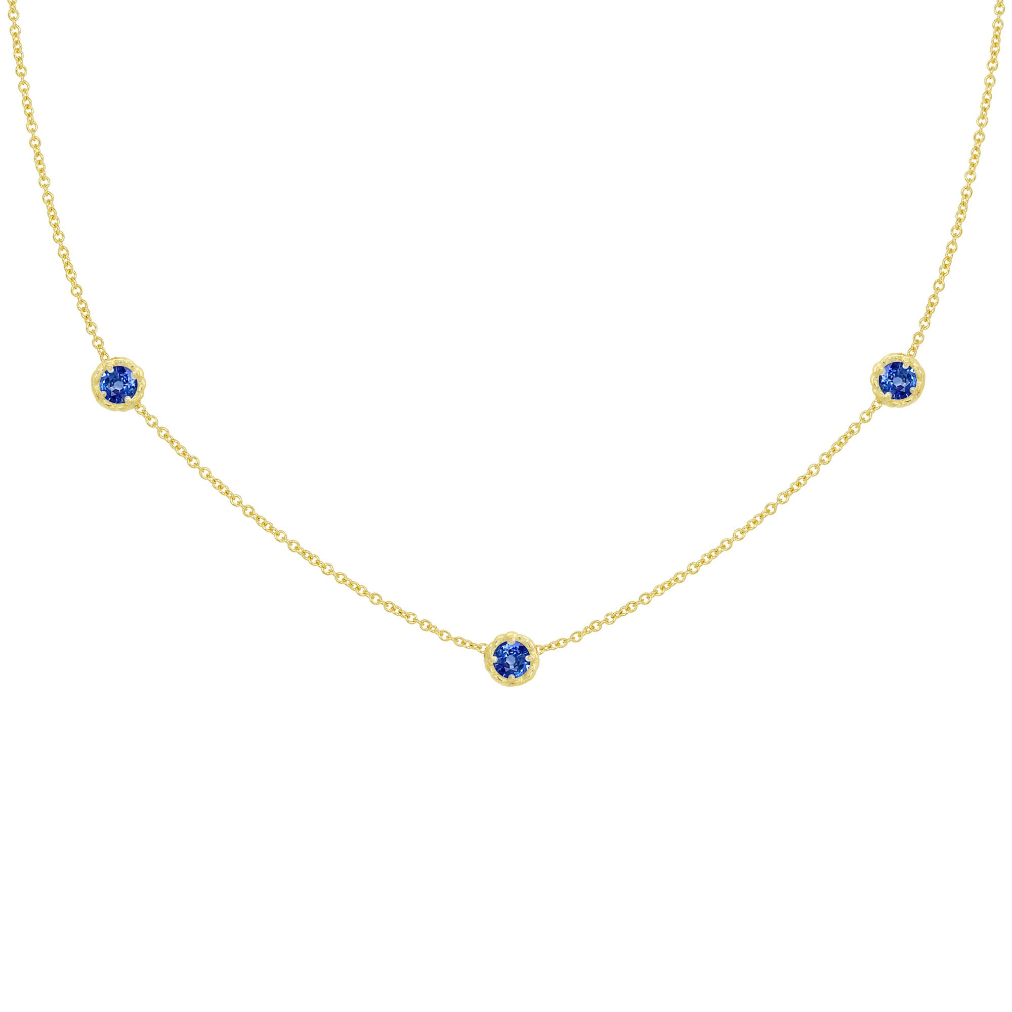 18K Gold necklace with three sapphire gemstones on a white background