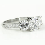 custom-designed platinum three stone Diamond ring with side pave diamonds on the band created by Laura Pearce