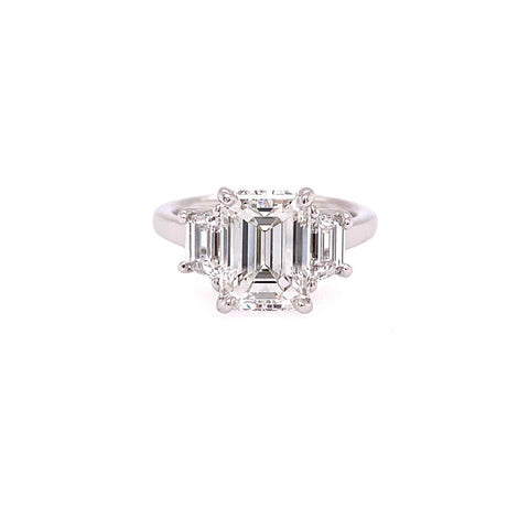 Platinum Emerald Cut Diamond Ring with Step-Cut Trapezoid Side Stones