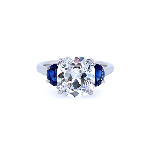 Platinum and cushion diamond ring  with  half moon sapphire sides