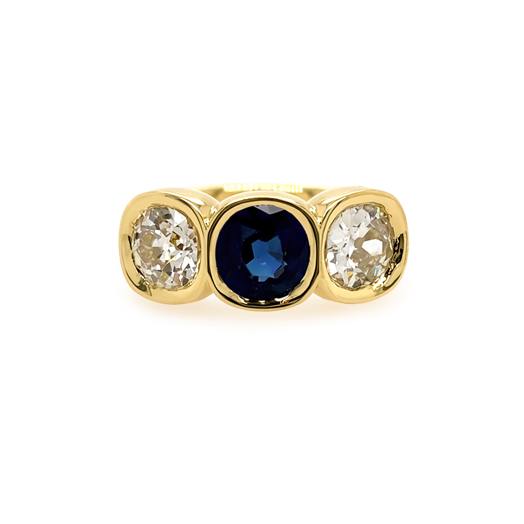 Gold ring with a sapphire flanked by two diamonds