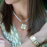 Woman wearing A 14K yellow gold hinged circle bail for pendants on necklaces 