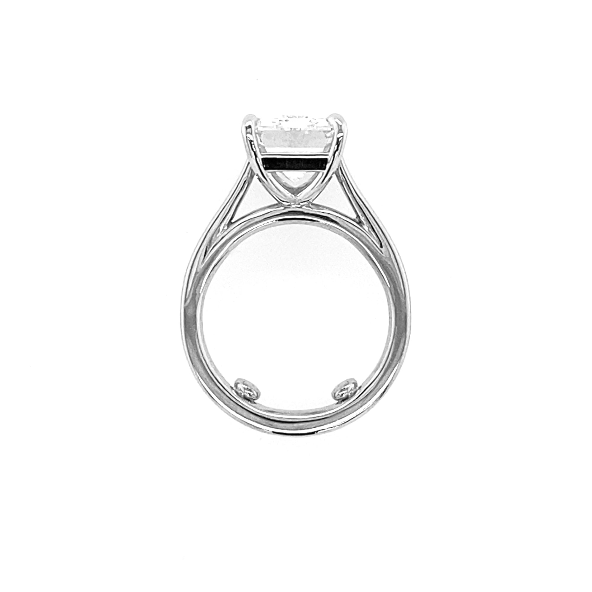 Platinum ring with solitaire emerald cut diamond 