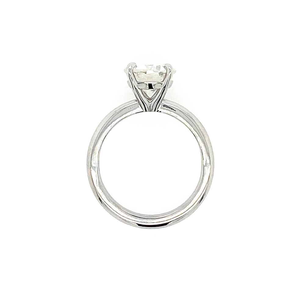 A platinum solitaire engagement ring with a round brilliant-cut diamond set in a four-prong setting, shown against a plain white background.