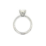 A platinum solitaire engagement ring with a round brilliant-cut diamond set in a four-prong setting, shown against a plain white background.
