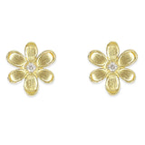 A pair of 18K yellow gold flower stud earrings with a textured petal design and a small clear round diamond in the center, shown on a plain white background.