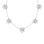 An 18K white gold floral necklace featuring five textured flower charms spaced along a delicate chain, set against a plain white background.