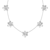 An 18K white gold floral necklace featuring five textured flower charms spaced along a delicate chain, set against a plain white background.