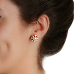 Close-up of a woman wearing an Akoya pearl earring with diamonds designed by Elizabeth Locke