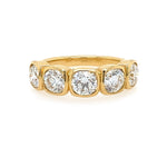18K Gold ring with five diamonds on a white background