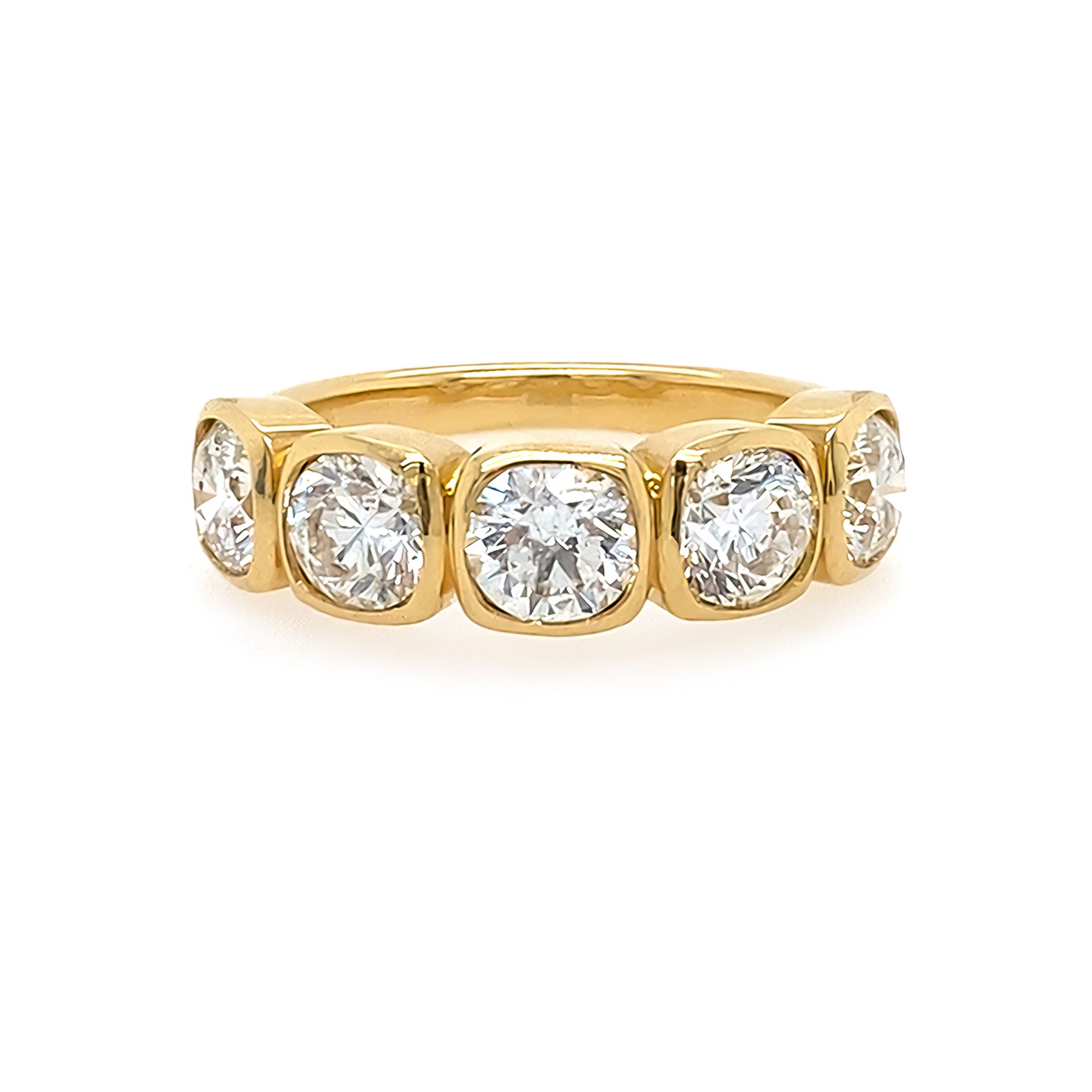 18K Gold ring with five diamonds on a white background