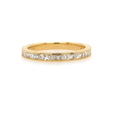 An 18K yellow gold band featuring princess cut diamonds arranged in a line.