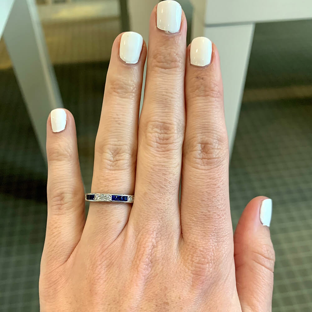 Woman wearing an Art Deco Sapphire and Diamond Platinum Band Ring