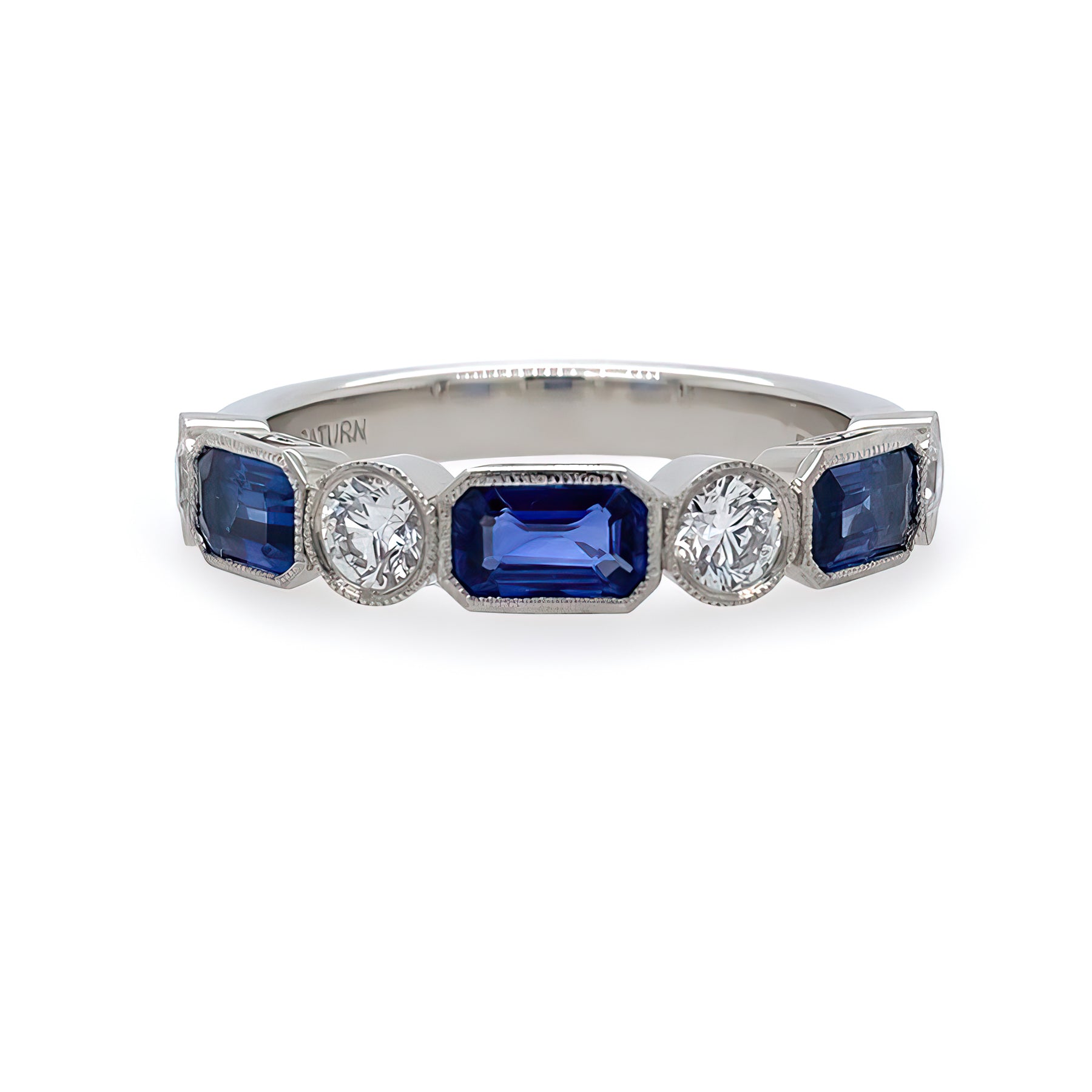 Ring with sapphire gemstones and diamonds on a white background