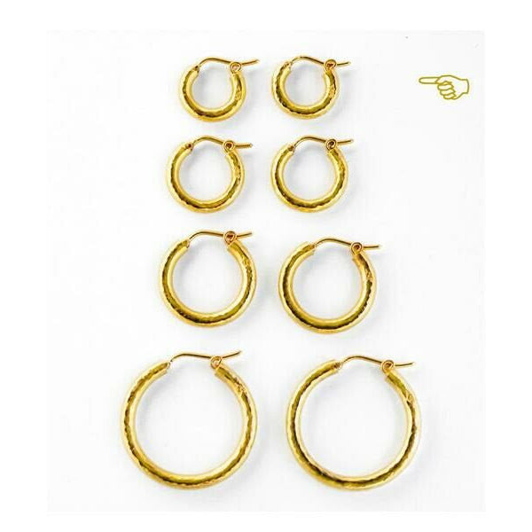 Four Sets of gold hoop earrings on a white background