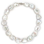 Baroque Pearl necklace with white gold clasp on a white background