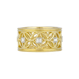 An 18kt yellow gold ring with inset diamonds in a geometric pattern