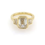 18k yellow gold bezel set emerald cut engagement ring with trapezoid side stones 