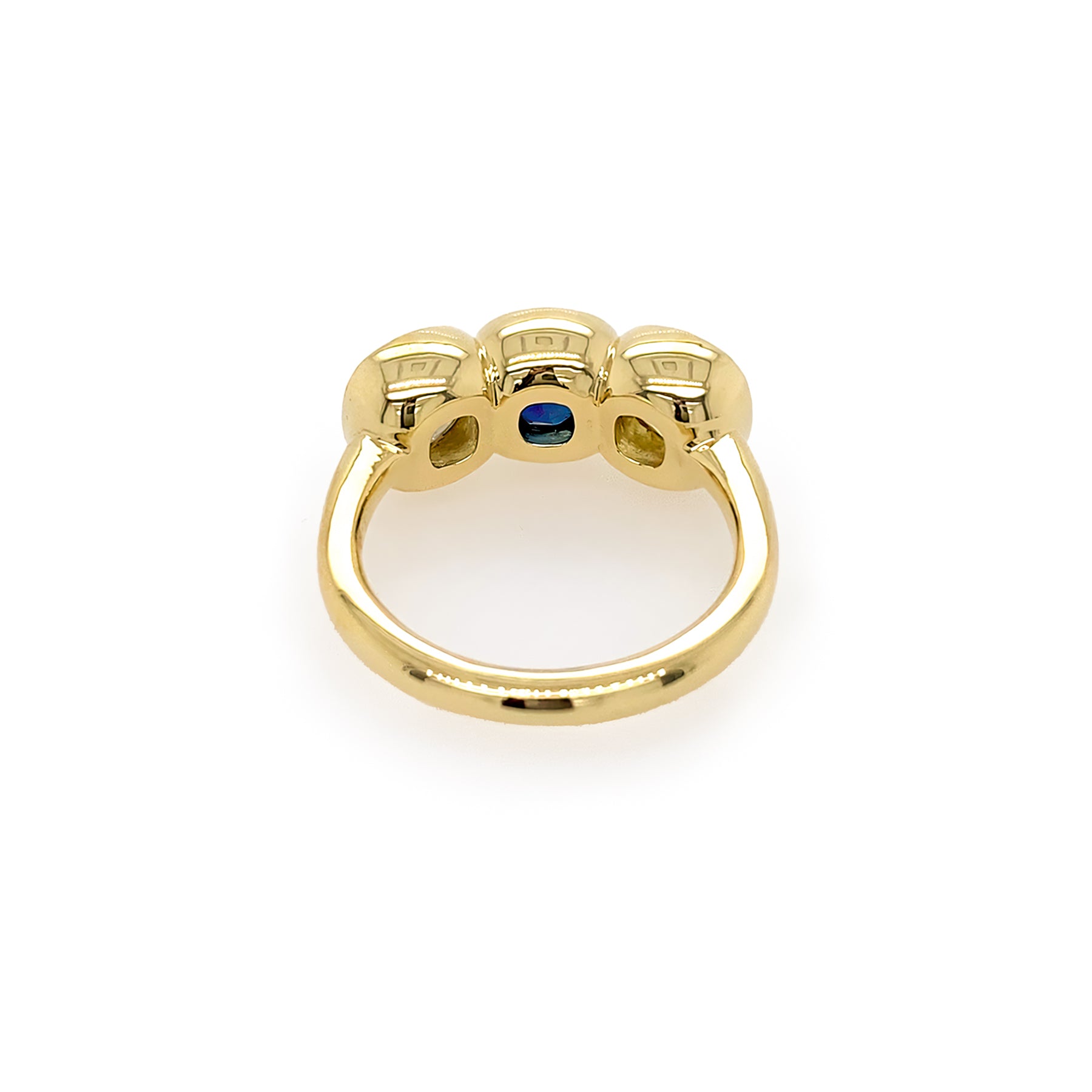 Custom designed 18K Gold ring with a central blue sapphire gemstone and side diamonds