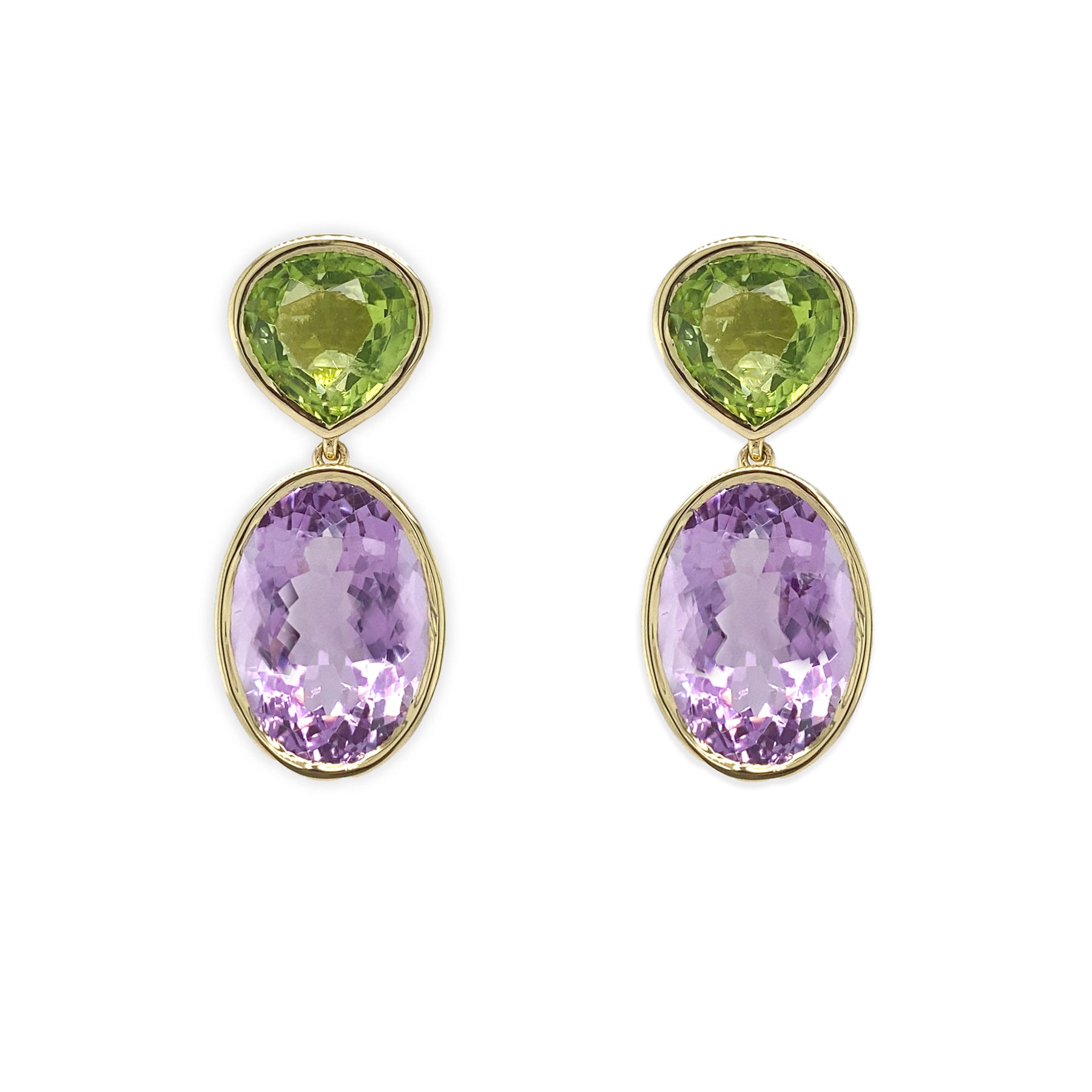 A pair of 18K yellow gold earrings featuring a large oval amethyst stone suspended from a smaller round peridot stone, set against a white background.