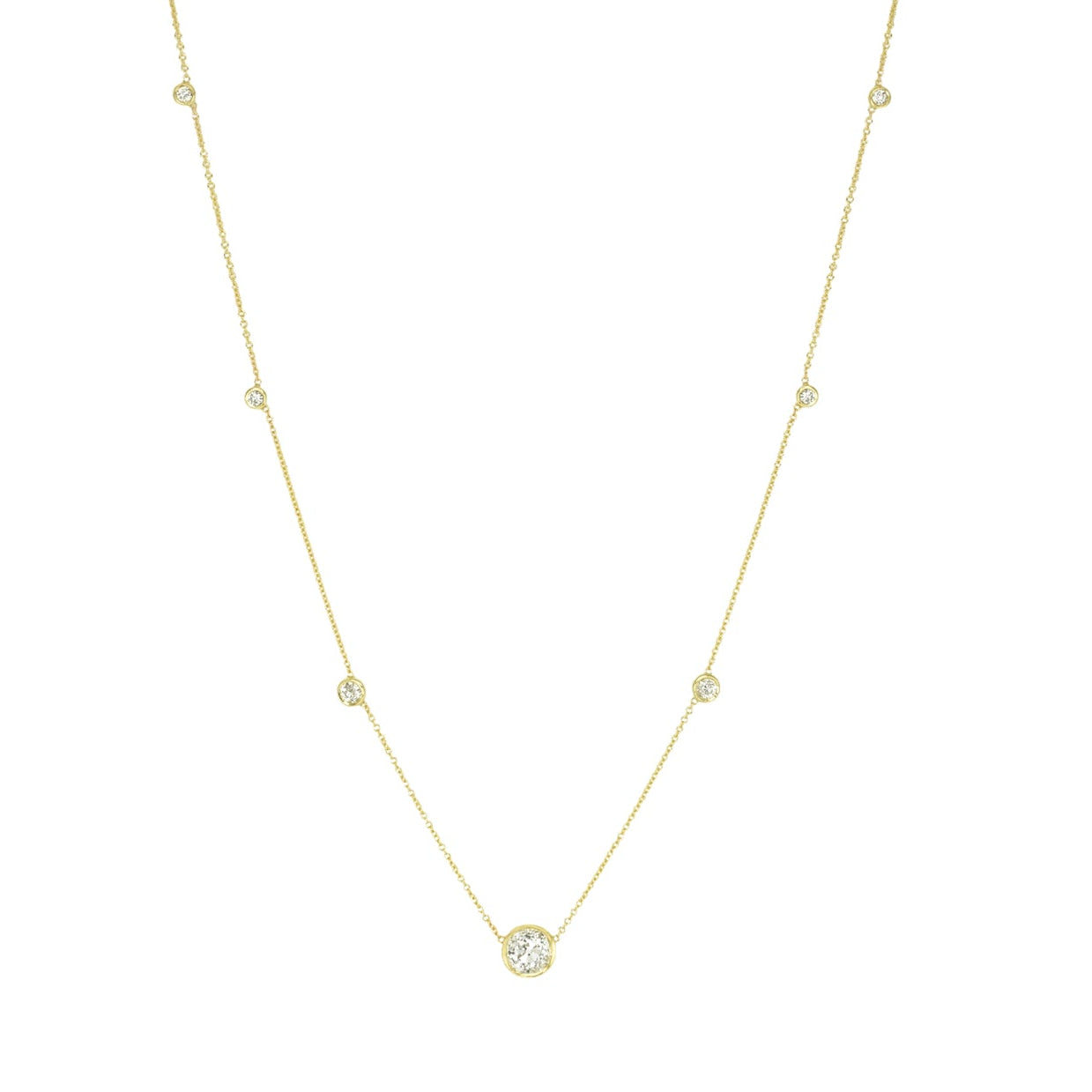 A custom designed 18kt yellow gold necklace with a series of round diamonds strung on a chain.