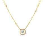 An 18kt yellow gold necklace with a bezel set diamond pendant.