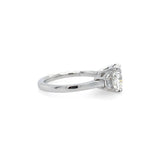 A platinum ring featuring a rectangular clear center diamond and two smaller side diamonds, shown from a side view on a plain white background.