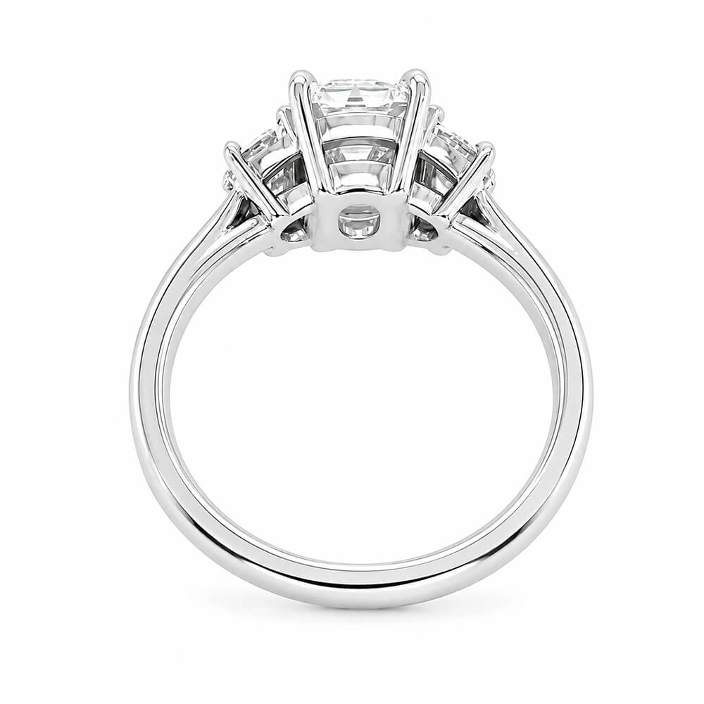 A platinum diamond ring with an old mine cut center diamond and smaller half moon side stones, shown from the back on a plain white background.