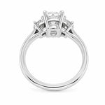 A platinum diamond ring with an old mine cut center diamond and smaller half moon side stones, shown from the back on a plain white background.
