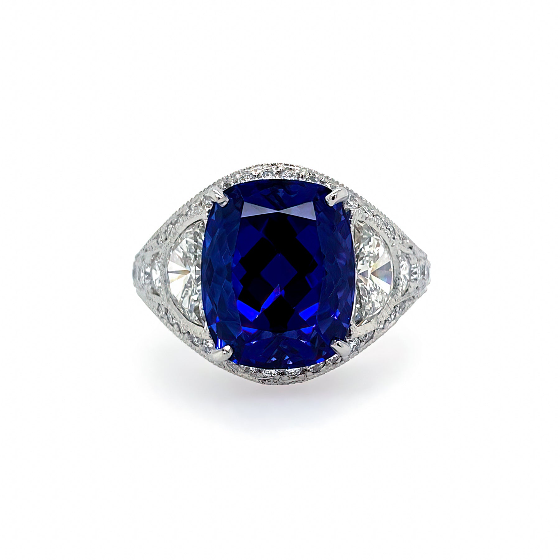 A ring with a large blue tanzanite gemstone surrounded by smaller clear diamonds