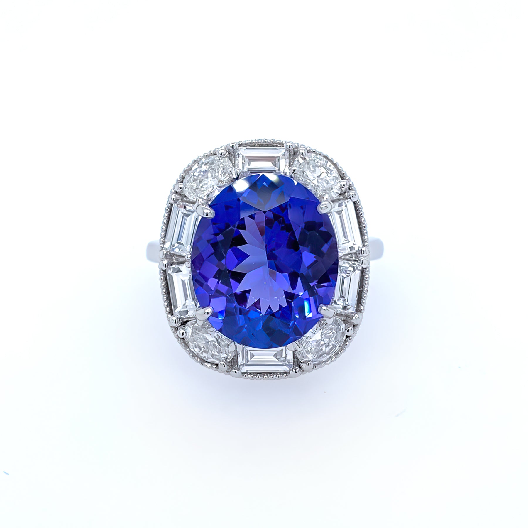A Custom Designed ring with a blue tanzanite gemstone surrounded by  smaller diamonds.
