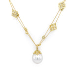 Gold necklace with a pearl pendant on a white background