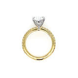 18K Gold band with platinum setting featuring oval diamond center stone