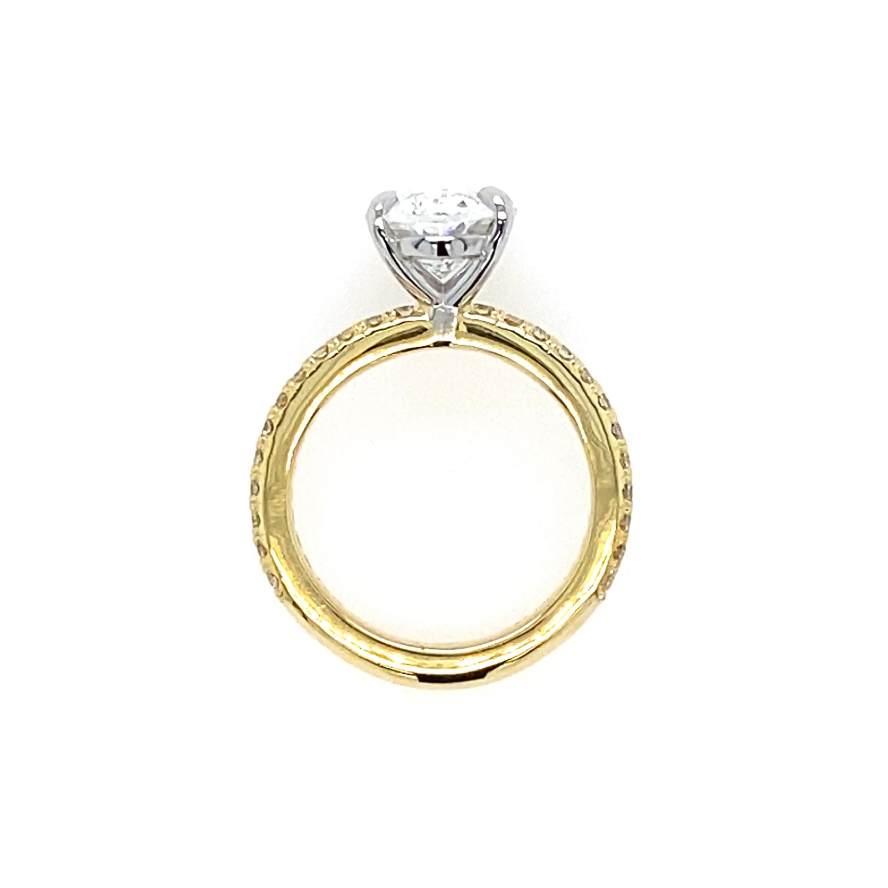 18K Gold band with platinum setting featuring oval diamond center stone