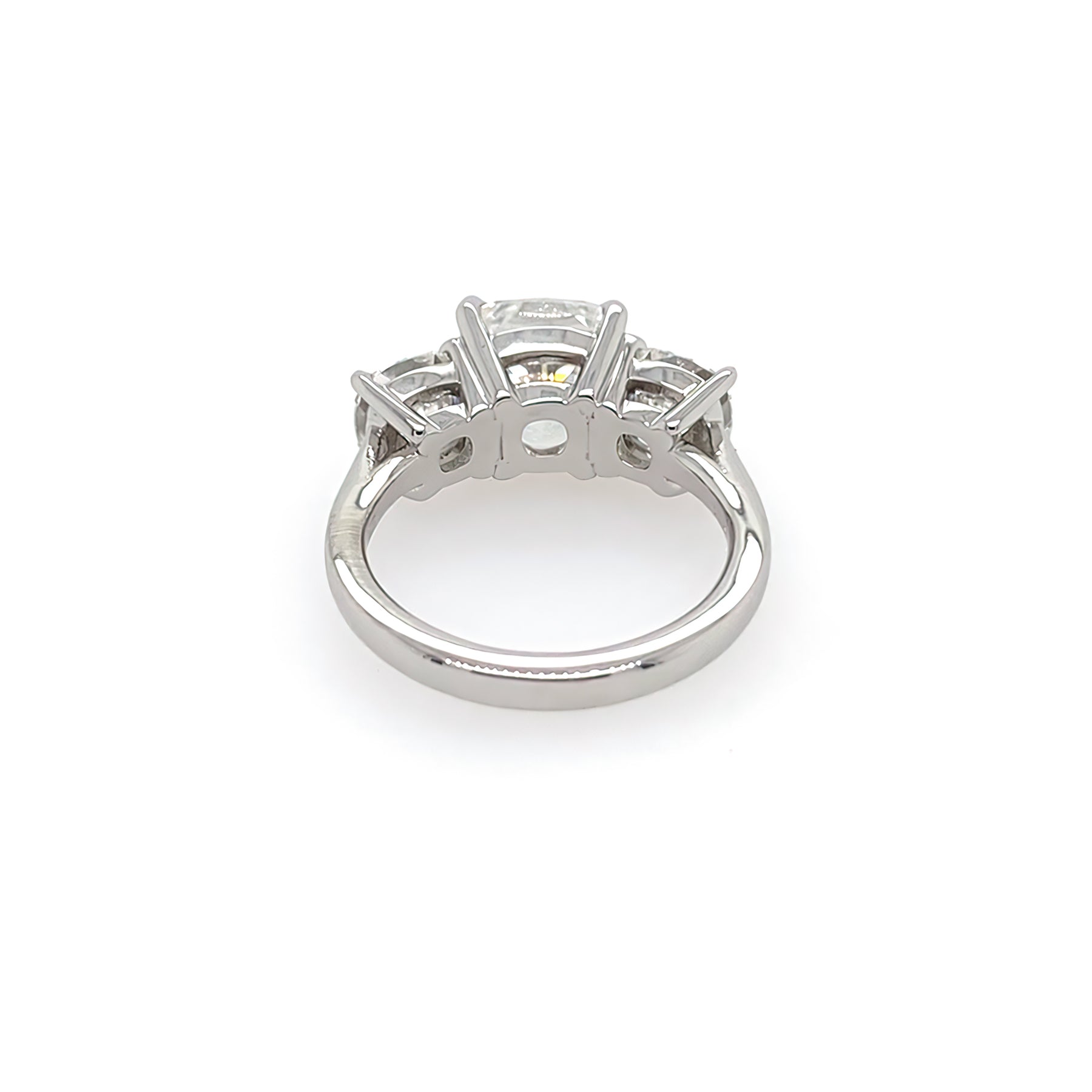 Back view of three stone diamond cushion cut ring
