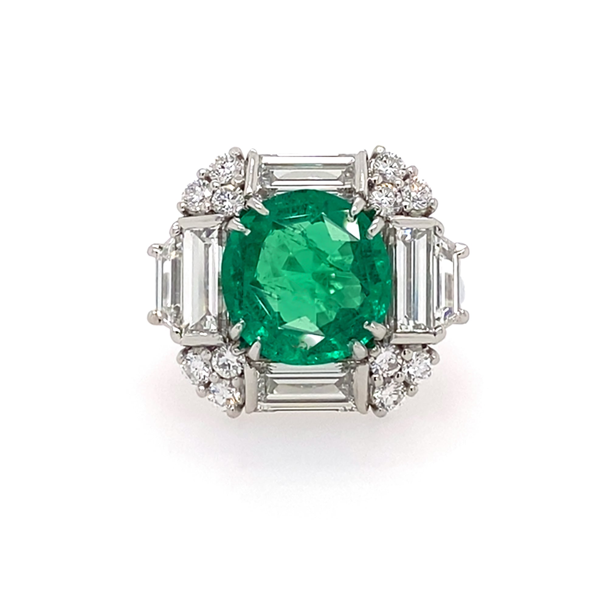 front view of platinum ring with a green emerald and diamonds