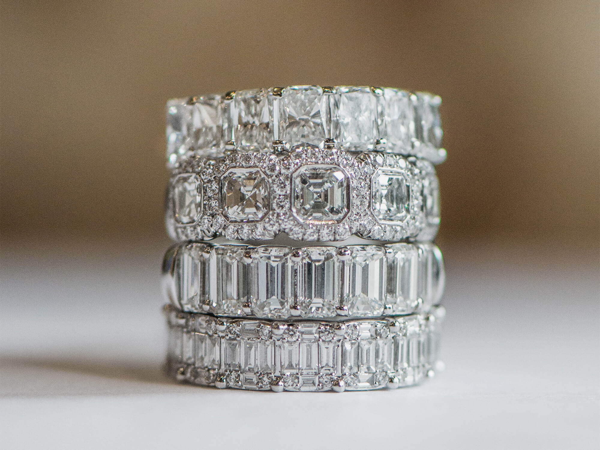 Stack of four custom-designed diamond band rings offered at Laura Pearce Ltd. 
