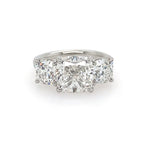 front view of custom designed three stone diamond cushion cut ring set in platinum