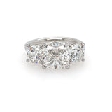 front view of custom designed three stone diamond cushion cut ring set in platinum