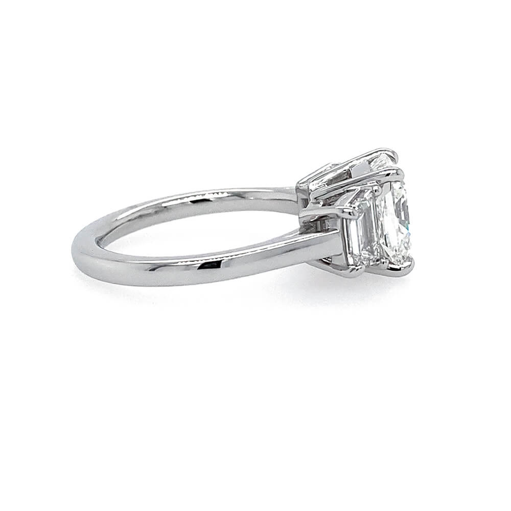 Custom designed Cushion Cut Diamond Ring with Trapezoid Diamond Side Stones in Platinum