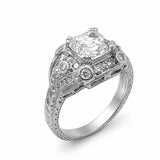An ornate platinum diamond ring with a large Asscher-cut center stone and smaller diamonds set in detailed filigree bands, shown on a white background.
