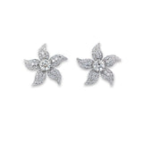 A pair of platinum and diamond flower stud earrings with a floral design.