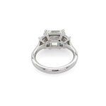 A platinum diamond ring featuring a rectangular east to west center diamond and smaller side diamonds, shown on a plain white background.