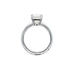 A platinum solitaire ring featuring a rectangular clear diamond in a prong setting, shown against a plain white background.