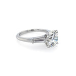 A classic solitaire diamond ring with a brilliant-cut center stone in a platinum metal setting, shown on a clean white background.