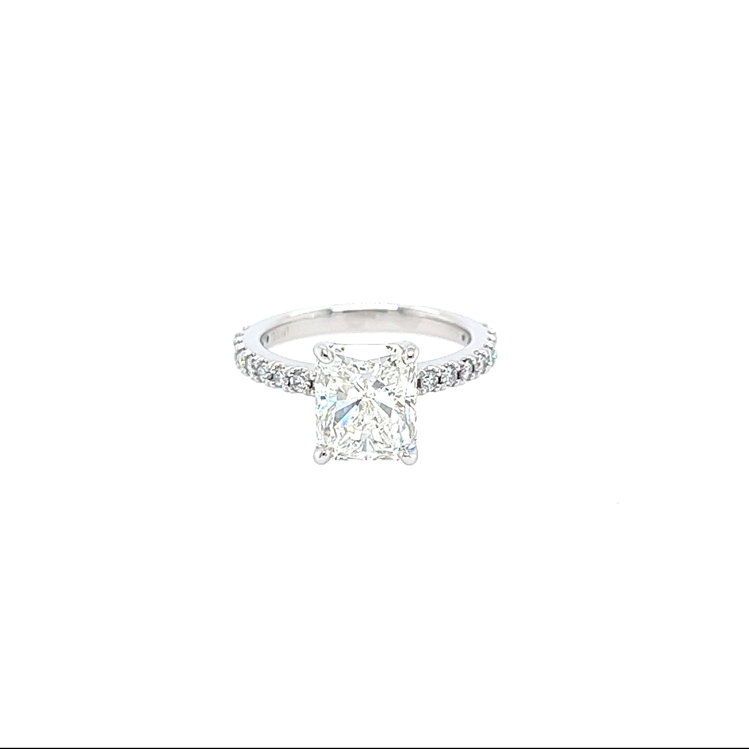 Diamond ring with a square radiant cut  center diamond stone on a white background